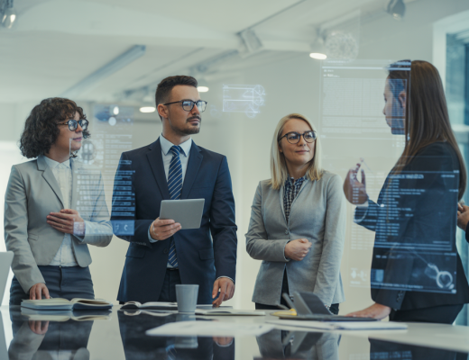 Diverse business professionals collaborating on a digital marketing strategy in a modern office, representing integrated agency solutions.